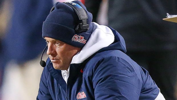 Ole Miss coach Lane Kiffin is destraught as his Rebels are blown out by the Arkansas Razorbacks in Fayetteville.
